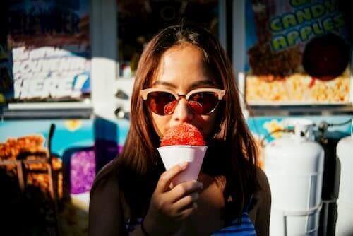 Lady Eating A Snow Cone