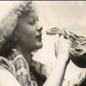 Florence Shufflebottom kissing a snake